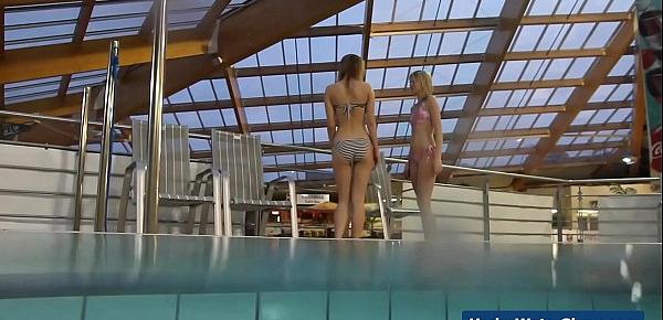  Horny girls strip eachother in the pool